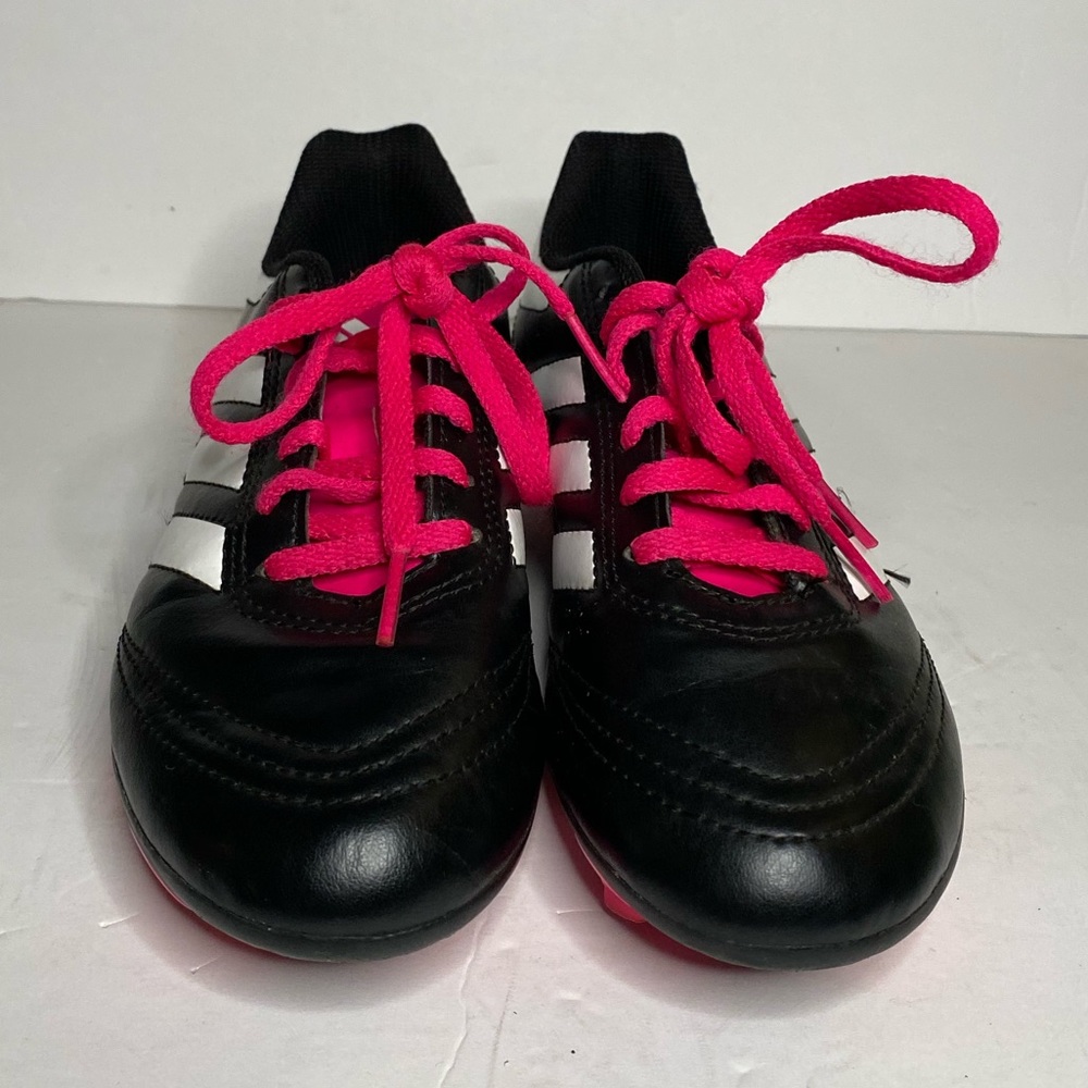 Pink and black adidas cleats